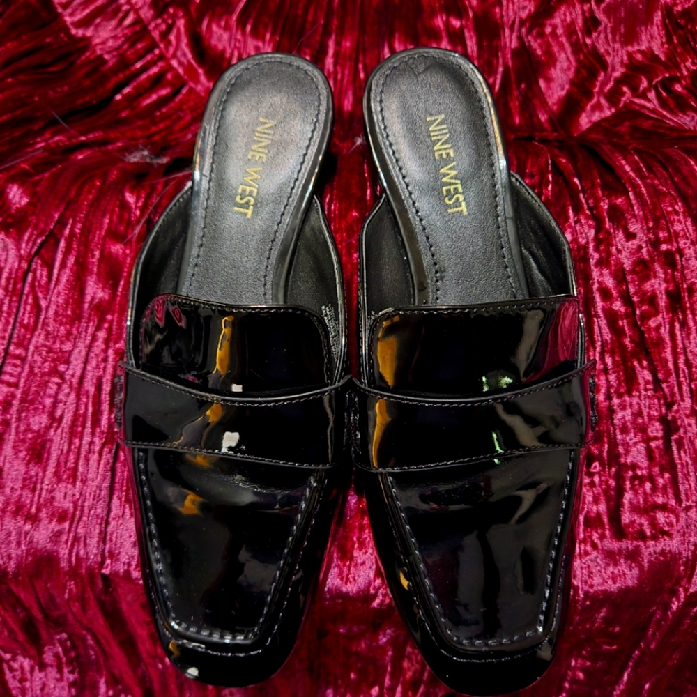 Black patent leather mules by Nine West